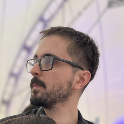 Picture of a white man with glasses with short brown hair.